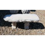 A STONEWORK WOODLAND GARDEN SEAT SUPPORTED BY TWO SQUIRRELS, LENGTH 100CM.