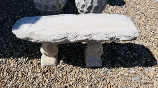 A STONEWORK WOODLAND GARDEN SEAT SUPPORTED BY TWO SQUIRRELS, LENGTH 100CM.
