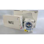 A NINTENDO WII GAMES CONSOLE IN ORIGINAL BOX ALONG WITH WII SPORTS RESORT AND WII FIT PLUS BOARD IN