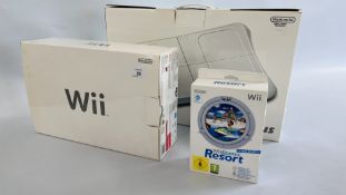 A NINTENDO WII GAMES CONSOLE IN ORIGINAL BOX ALONG WITH WII SPORTS RESORT AND WII FIT PLUS BOARD IN