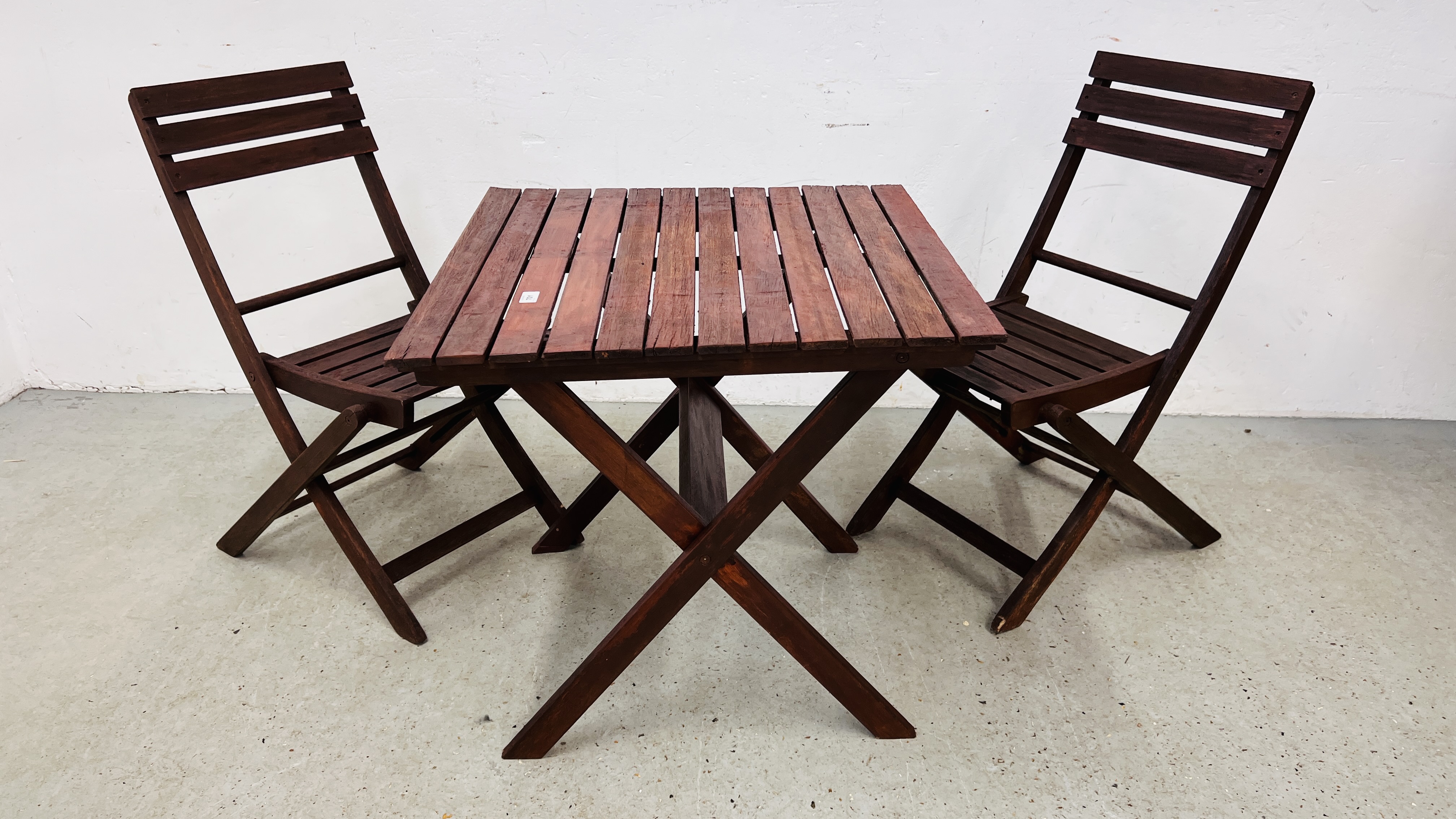 A GARDEN BISTRO TABLE AND 2 CHAIRS.