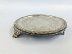 A SILVER CIRCULAR SALVER WITH NULLED RIM ON SCROLLED TRIPOD FEET BY JOESEPH WALKER OF DUBLIN C17