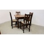 AN OAK 1940'S DRAWER LEAF DINING TABLE WITH A SET OF FOUR OAK BARLEY TWIST DINING CHAIRS.