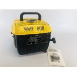 A PETROL WOLF POWER 800 PORTABLE GENERATOR COMPLETE WITH HAND BOOK.