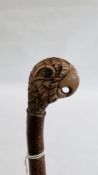 A VINTAGE STYLE WALKING STICK, THE HANDLE DEPICTING A PARROT.