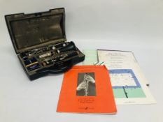 A CLARINET MARKED "BUFFET" IN A FITTED HARDCASE ALONG WITH VARIOUS MUSIC BOOKS.
