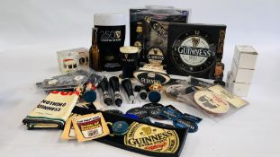 A BOX OF ASSORTED GUINNESS ADVERTISING MEMORABILIA TO INCLUDE CLOCKS, COASTERS,