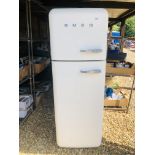 A SMEG CREAM FINISH FRIDGE FREEZER - SOLD AS SEEN.