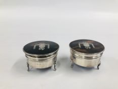 A PAIR OF SILVER AND TORTOISESHELL CIRCULAR TRINKET BOXES ON TRIPOD BASE, ONE MARKED 1929,