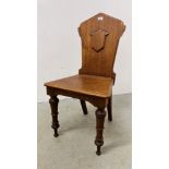 A VICTORIAN OAK HALL CHAIR.