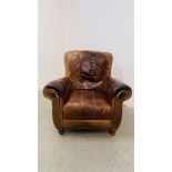 A TAN LEATHER EASY CHAIR WITH WORN PATINA.