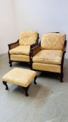 A PAIR OF BERGÈRE MAHOGANY ARMCHAIRS ON BALL AND CLAW FEET.