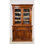 A VICTORIAN WALNUT TWO DOOR BOOKCASE WITH SECRETAIRE DRAWER AND CUPBOARD BELOW W 120CM D 43CM H