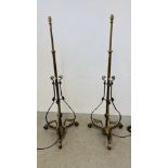A PAIR OF VICTORIAN BRASS STANDARD LAMPS CONVERTED FROM OIL LAMP STANDS - SOLD AS SEEN.