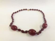 AN AMBER TYPE NECKLACE L 90CM.