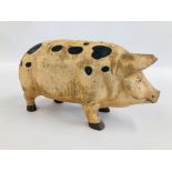 A LARGE REPRODUCTION CAST IRON PIGGY BANK / MONEY BANK - H23CM X W 16CM X L 45CM.