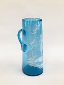 A VINTAGE MARY GREGORY STYLE JUG DECORATED ON A PALE BLUE GLASS H 25.5CM.