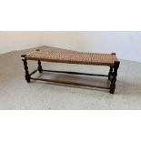 A VINTAGE OAK FRAMED RECTANGULAR FOOT STOOL WITH WOVEN TOP, W 91CM X D 30CM X H 30CM.