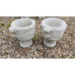 A PAIR OF STONEWORK PEDESTAL TUB PLANTERS WITH SCROLLED HANDLES AND FOLLIATE DESIGN, HEIGHT 46CM,