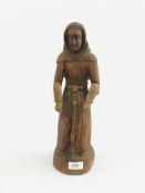 A RELIGIOUS CARVED FIGURE WITH MOVEABLE ARMS - H 39CM.