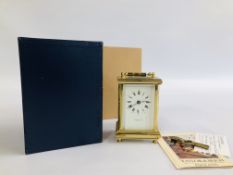 A VINTAGE REPRODUCTION BRASS CARRIAGE CLOCK MARKED "TAYLOR & BLIGH" WITH KEY AND BOX.