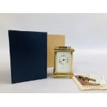 A VINTAGE REPRODUCTION BRASS CARRIAGE CLOCK MARKED "TAYLOR & BLIGH" WITH KEY AND BOX.