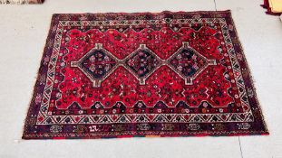 A LARGE TURKOMAN RED & BLUE RUG HAVING 3 CENTRAL MOTIFS OF DIAMOND FORM,