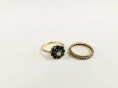 A 9CT GOLD RING SET WITH A CENTRAL OPAL IN A FLOWER HEAD SETTING ALONG WITH AN UNMARKED ETERNITY