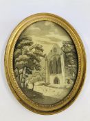 AN EARLY C19TH SILK EMBROIDERY OF A RUINED ABBEY IN AN OVAL GILT FRAME BEARING LABEL FREEMAN OF