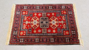 AN ORIENTAL RUG WITH DOUBLE MIHRAB,