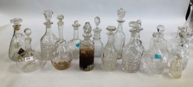 A COLLECTION OF 16 GLASS DECANTERS TO INCLUDE PRESSED AND CUT GLASS EXAMPLES.