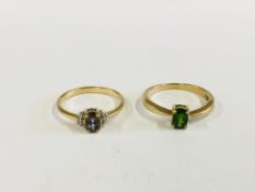 TWO 9CT GOLD RINGS TO INCLUDE ONE EXAMPLE SET WITH A CENTRAL GREEN OVAL STONE.