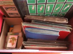 BOX WITH CIGARETTE CARDS IN CORNER SLOT ALBUMS, CARD GAMES, OBSERVER BOOKS AND THREE FRAMES.