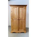 A GOOD QUALITY WAXED PINE TWO DOOR WARDROBE, W 113CM X D 57CM X H 191CM.