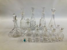 A COLLECTION OF 15 GLASS DECANTERS TO INCLUDE PRESSED AND CUT GLASS EXAMPLES.