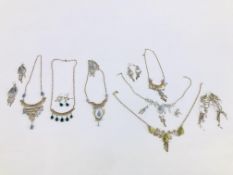 A GROUP OF 6 WHITE METAL PERUVIAN STONE SET NECKLACE AND EARRING SETS.