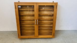 A MODERN GLAZED TWO DOOR WALL MOUNTED DISPLAY CASE - W 76CM X H 72CM X D 12.5CM.