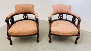 A PAIR OF MAHOGANY FRAMED TUB CHAIRS.