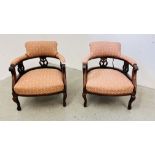 A PAIR OF MAHOGANY FRAMED TUB CHAIRS.