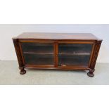 A LOW LEVEL TWO DOOR MAHOGANY BOOKCASE - W 108CM X D 32CM X H 55CM.