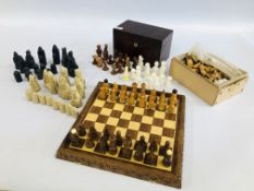 THREE CHESS SETS TO INCLUDE A CARVED NOVELTY EXAMPLE ALONG WITH A GLASS AND RESIN EXAMPLE AND A