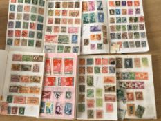 MAINLY FOREIGN STAMPS IN TWO STOCKBOOKS AND CLUB BOOKS, SOME STUCK DOWN AFFECTED BY DAMP.