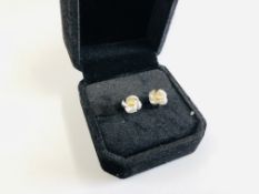 18K WHITE GOLD STUD EARRINGS SET WITH CENTRAL DIAMOND WITH ORIGINAL RECEIPT.