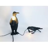 A MODERN DESIGNER COMPOSITE PENGUIN FIGURED LAMP ALONG WITH A SIMILAR CROW EXAMPLE BEARING MAKERS