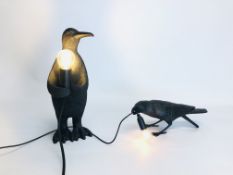 A MODERN DESIGNER COMPOSITE PENGUIN FIGURED LAMP ALONG WITH A SIMILAR CROW EXAMPLE BEARING MAKERS