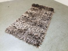 A MODERN DUNELM MINK COLOURED SHAGGY PILE RUG, 80CM X 150CM.