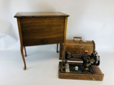 A VINTAGE SINGER SEWING MACHINE IN FITTED CASE ALONG WITH A SILK LINED SEWING BOX ON SPLAYED LEGS.