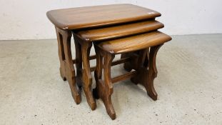 A NEST OF THREE ERCOL WINDSOR OCCASIONAL TABLES.