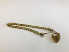 A 9CT GOLD HEART LOCK BRACELET AND SAFETY CHAIN.