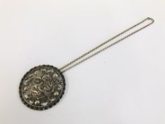 AN UNUSUAL PERSIAN / EASTERN WHITE METAL CIRCULAR PENDANT INSCRIBED CHRISTMAS 1944 TO REVERSE ON A